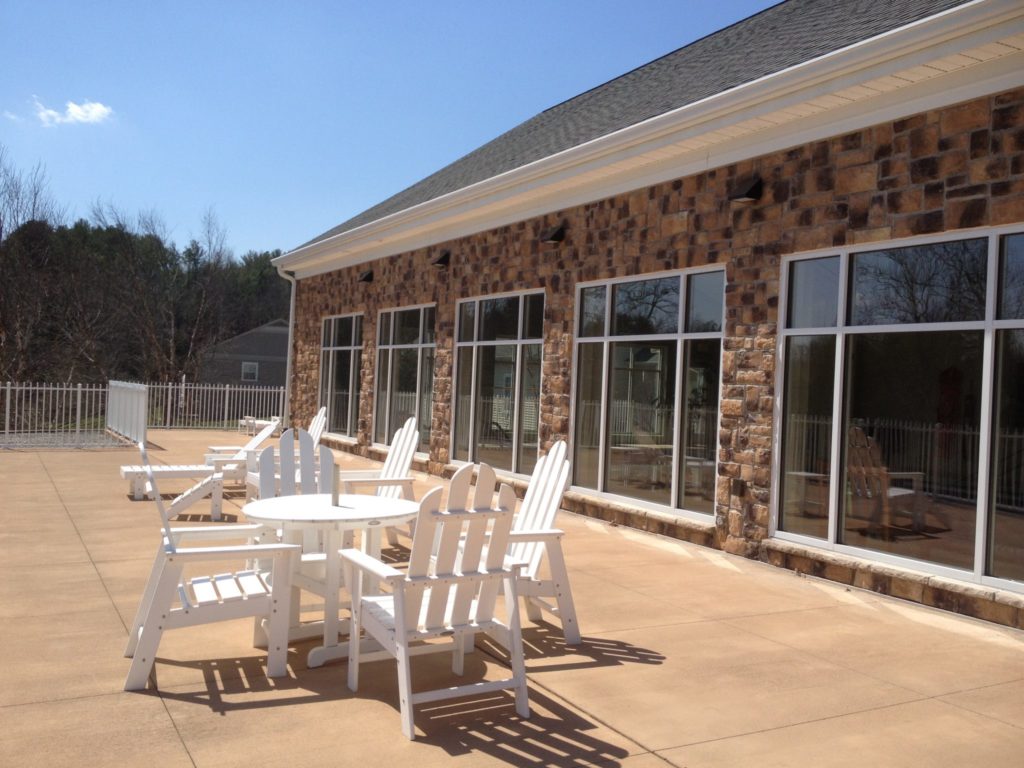 Adirondack chairs and table on the sun deck