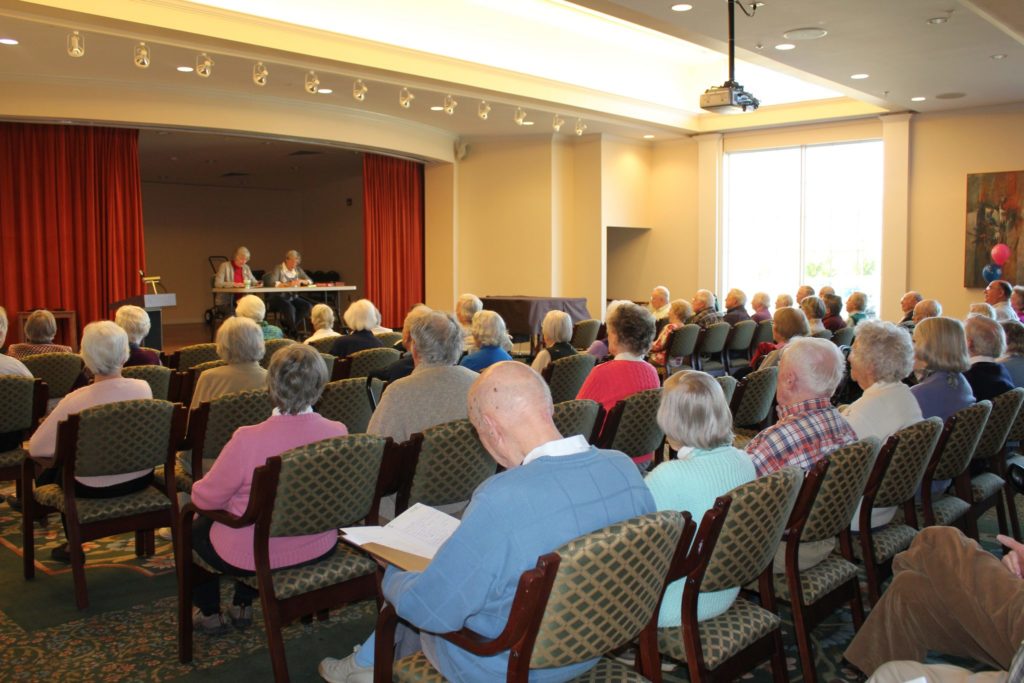 Audience of residents gathered for a meeting