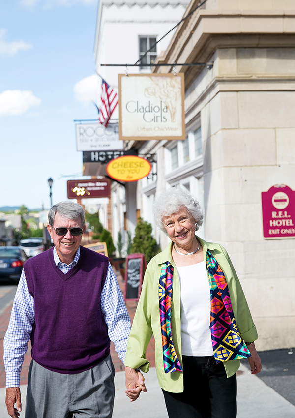Resident couple walking through downtown Lexington