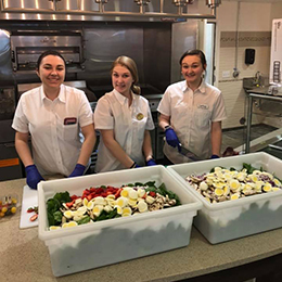 Culinary staff preparing meals to go