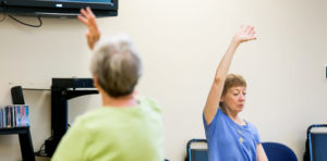 women exercising arm up