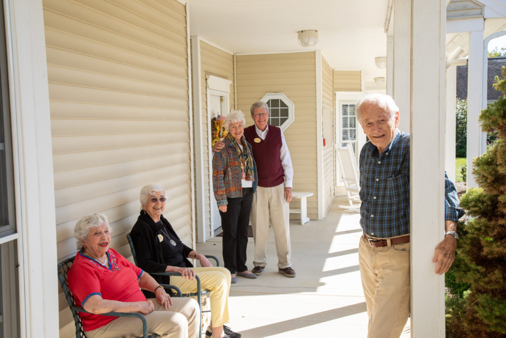 residents on covered walkway