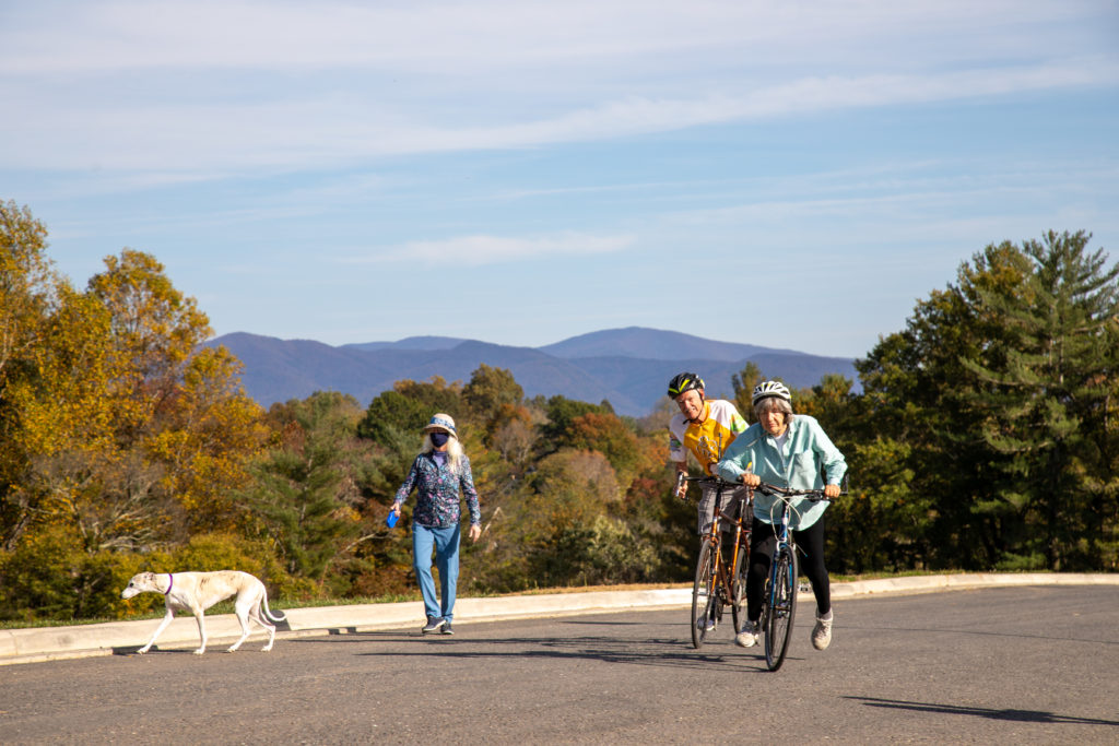 residents bike riding and dog