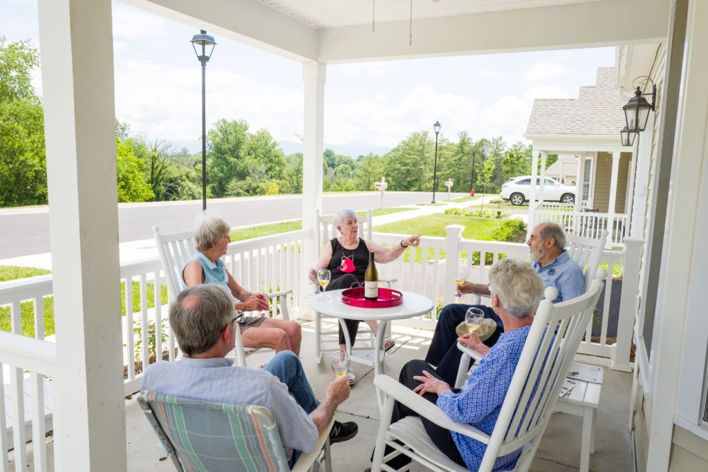 people chatting on front porch