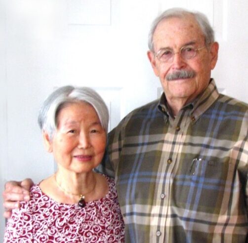 Sangmie and Bill hug for a photo